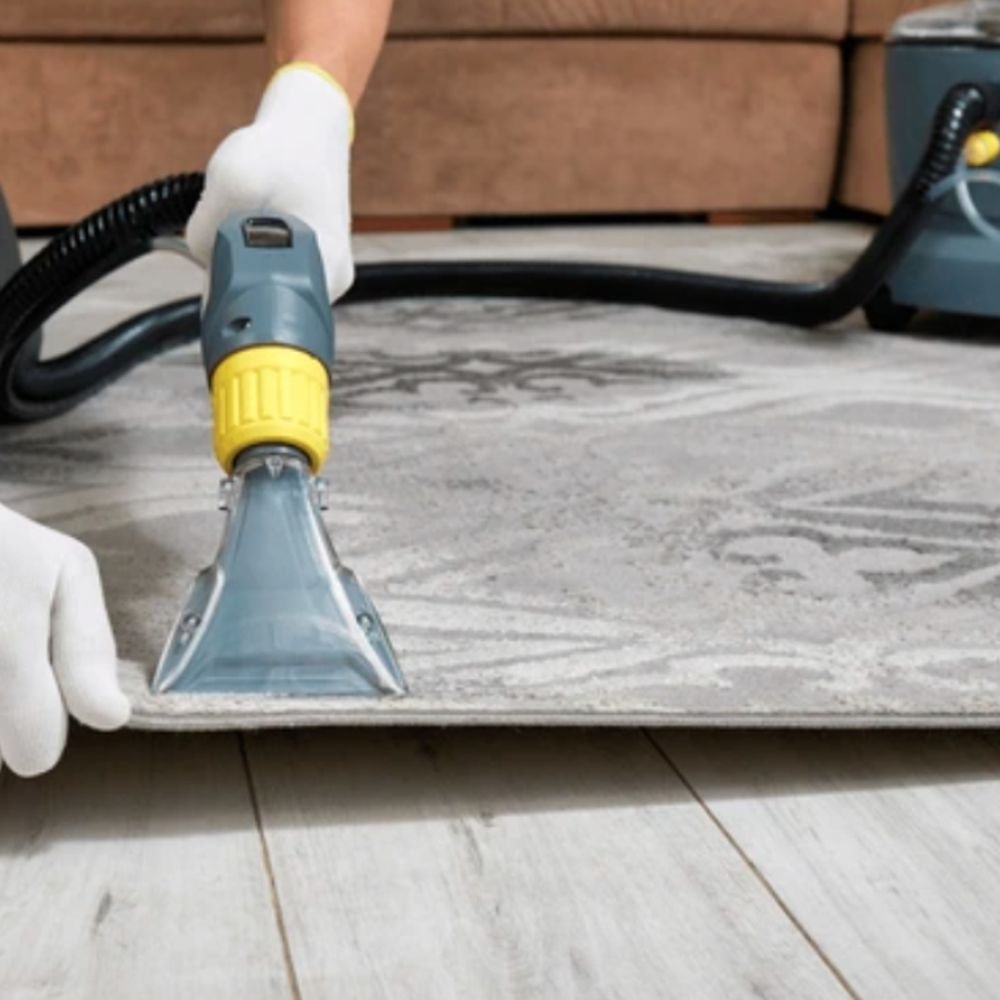 Professional performing standard cleaning on bathroom surfaces with organized tools and careful technique